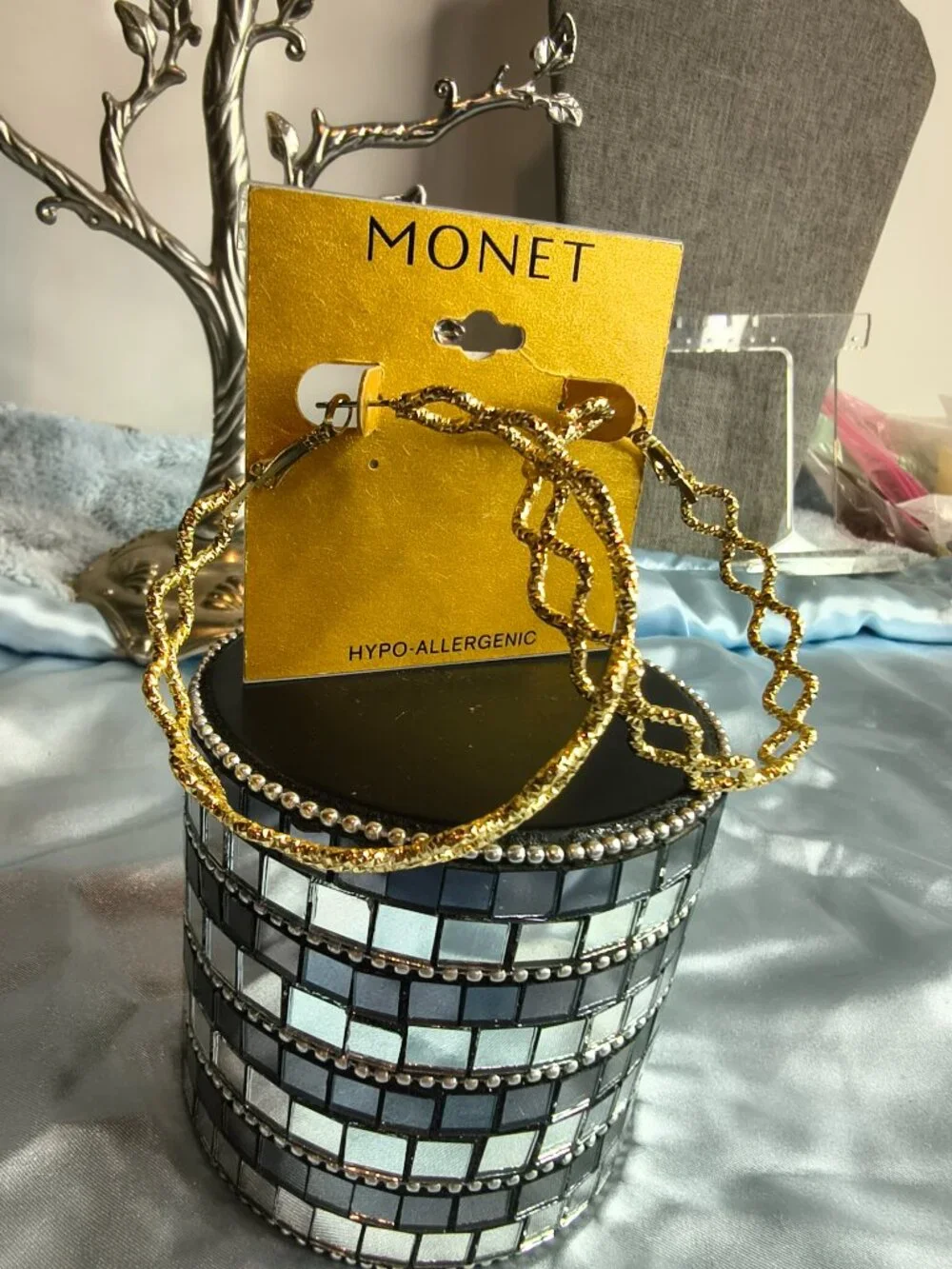 Monet Gold Tone Criss Cross Hoop earrings